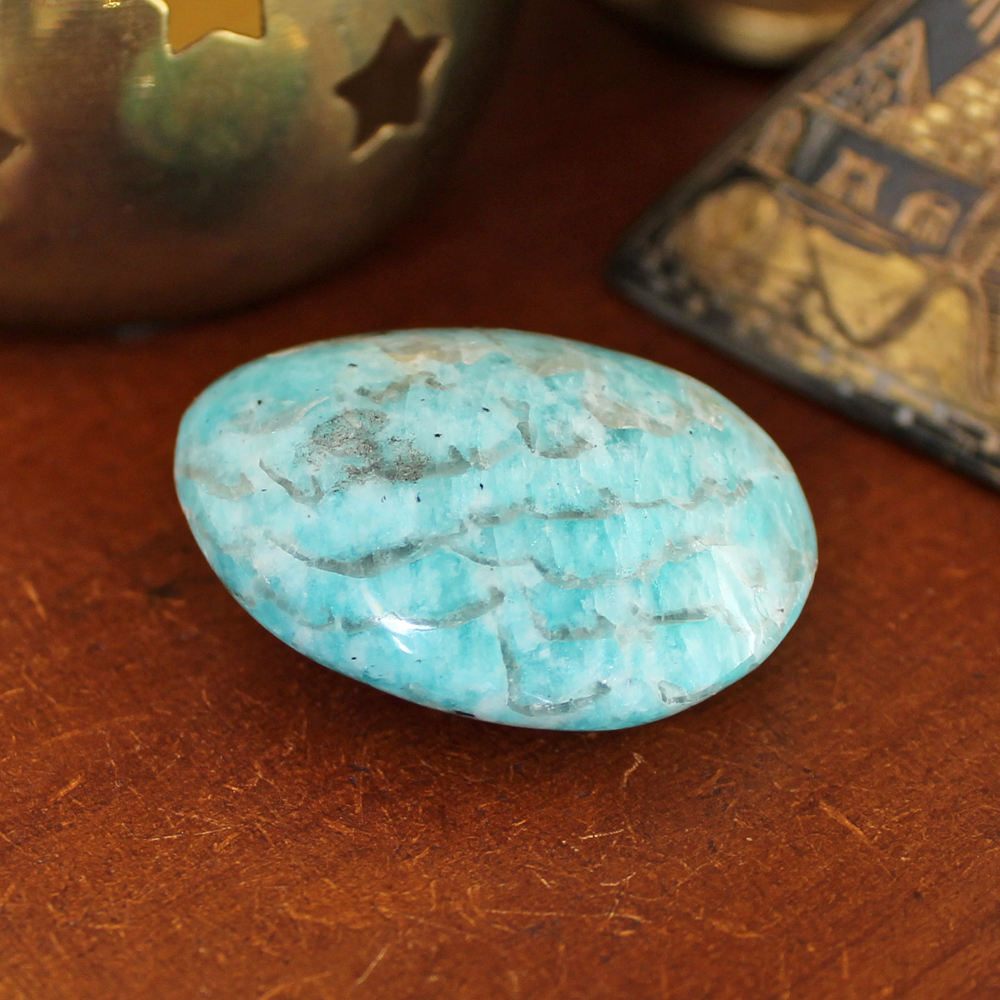 Amazonite ranges from green to blue green, can have white or black veins.