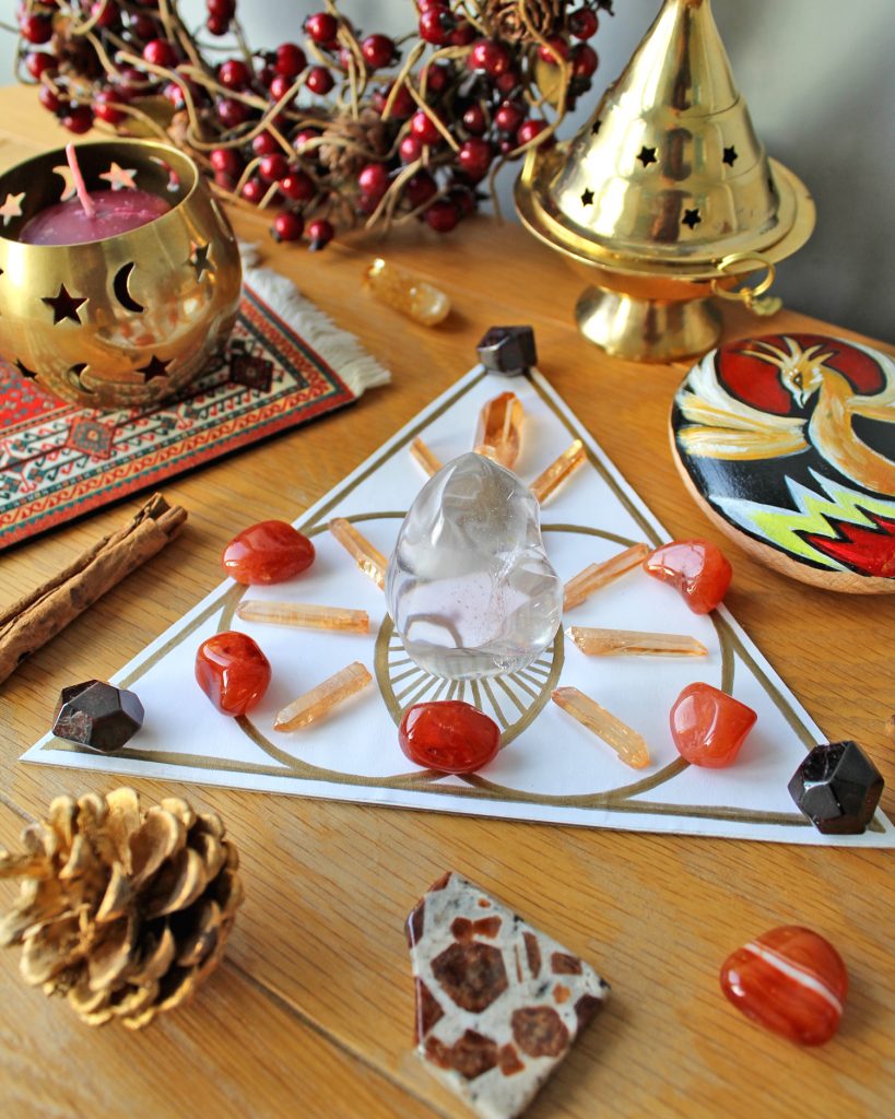 Energy boosting crystal grid with red and orange crystals