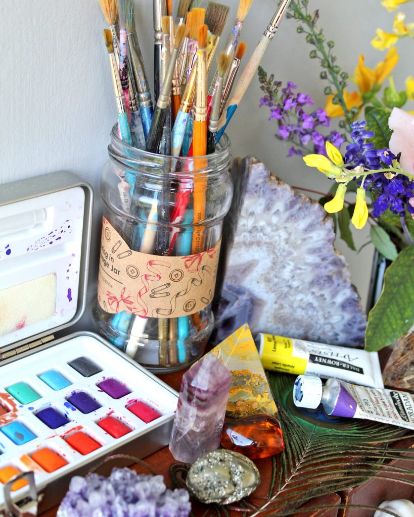 Watercolours, paints, paint brushes and crystals