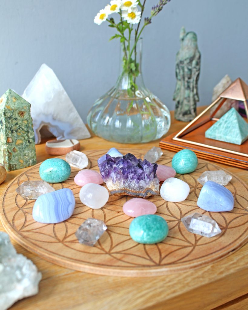 Crystal grid, pyramid, flower case and stones