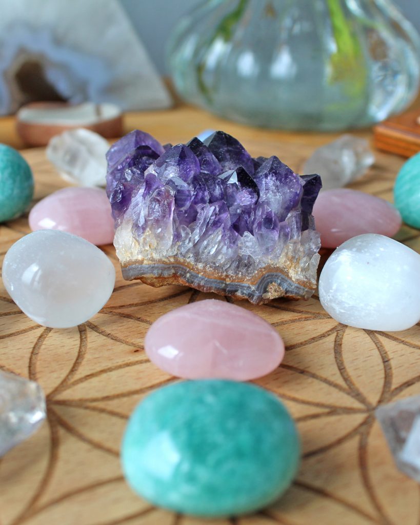Close up of crystal grid with amethyst cluster
